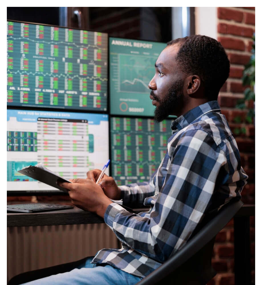 Image of a man analyzing financial data.