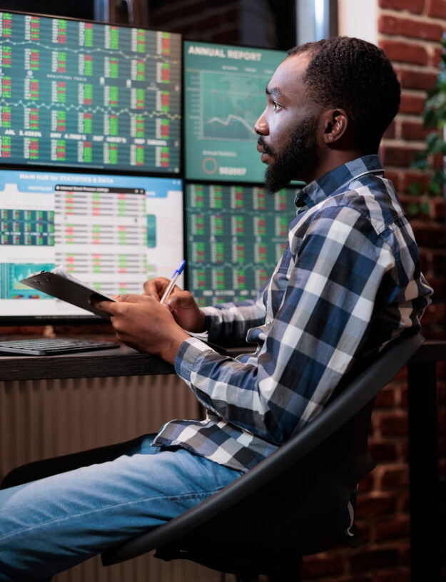 Image of a man analyzing financial data.